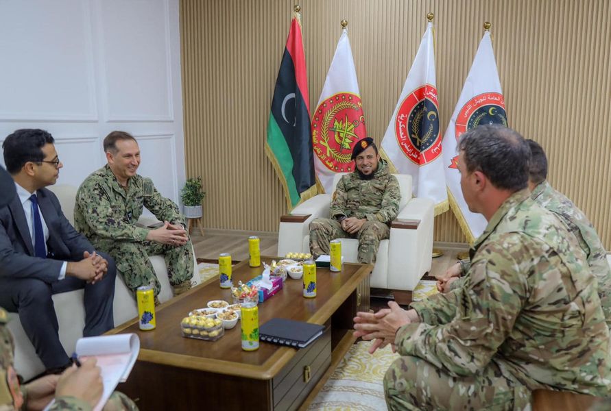 An American military delegation discusses training with the 444th Combat Brigade in Tripoli.